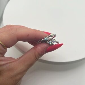 239. QUDO set of‎ 4 white gold plated over stainless steel stackable rings